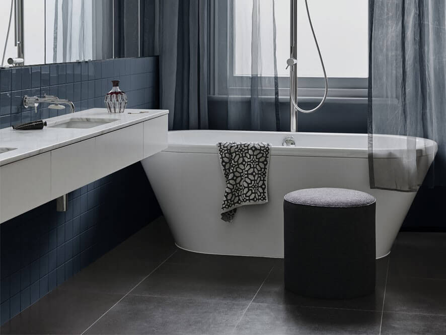 Deep Blue and White Bathroom with Tiles and Marble Counter Top and Sink